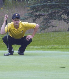 <span class='credit'>Photo By: Kristyn Sonnenberg | Photo Editor</span><span class='description'>Senior Eric Lilleboe analyzes his angle for a put into hole  two at Saturday’s tournament. Lilleboe was a first place medalist with his even-par 210 score.</span>