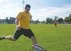 Photo By: Sam Lehnert | Ad Layout AssistantFreshman Jarrod Daul kicks off at rugby practice on Friday, Sept. 4. The team is short on players going into its 19th season and is looking for some aggressive new faces to tackle the new school year with them.