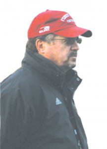 Coach Pierce: Head coach Jeff Pierce presides over a football team practice last week. Pierce has led the Bulldogs through 10 winning seasons and will continue to be there for them through this rough year. Photo By: Kate Dupon Photographer