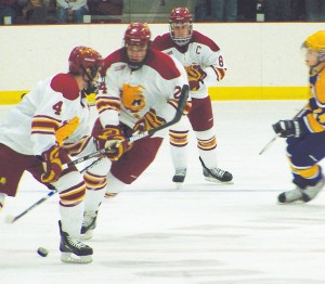 <span class='credit'>Photo By: Kristyn Sonnenberg | Photo Editor</span><span class='description'>Bulldogs on Ice: Chad Billins (#4), Zach Redmond (#24), and Cody Chupp (#8) press toward the goal at Sundays exhibition game against Wilfred Laurier. The Bulldogs lost 3-1, with Billins, a sophomore, scoring the single goal. The season officially begins next weekend in Buffalo, New York against the Canisius Golden Griffins.</span>
