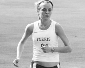 All-America runner Tina Muir maintains her stride at the Ray Helsing Bulldog Invitational. Muir, a junior, took first place in this race. Photo courtesy of Sandy Gholston.