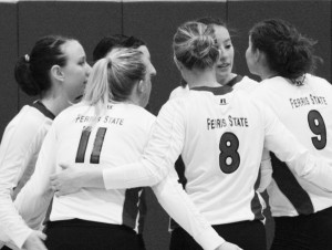 The volleyball team talks strategy during the game against Ashland. Photo By: Kate Dupon | Photographer