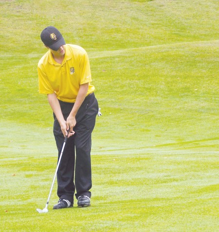 Swinging Ahead: Former Ferris golfer, Eric Lilleboe, analyzes a shot on the green during his warm-up. Lilleboe qualified for the U.S. Amateur Championship at Chambers Bay in University Place, Wash. and also co-medaled at the U.S. Amateur Qualifer in Harbor Springs. Torch File Photo