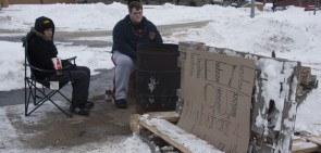 Freezing for a Good Cause: Davey Le and Ben Eckert, above, sat in the freezing cold during Alpha Chi Rho’s annual freeze out. The freeze out helped raise money for Habitat for Humanity. Photo By: Kate Dupon | Photo Editor