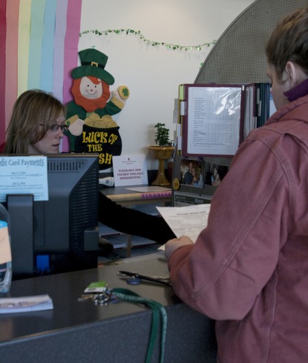 Students Affected: Tarin Hetherington talks with a student service representative about transcripts and payments. Pell Grants at Ferris State may be reduced by $845, causing many students to lose vital aid. Photo By: Kate Dupon | Photo Editor