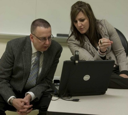 Gearing Up: David Verbeek and Dawn Tahaney, Ferris MBA students, prepare for their presentation in the case study competition hosted by the Association for Corporate Growth. Photo By: Kate Dupon | Photo Editor