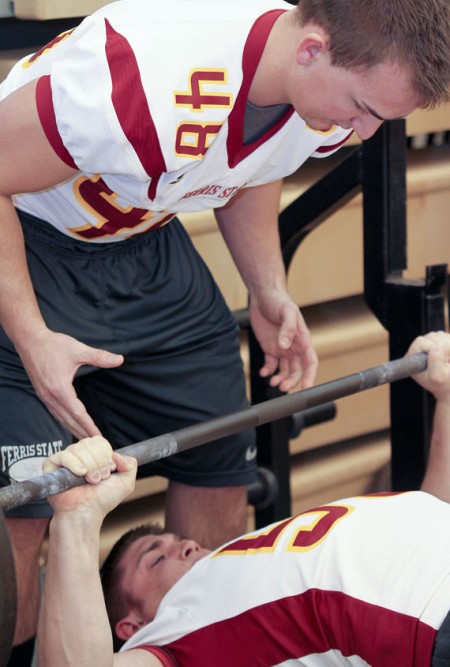 Get Your Lift On: Sophomore Cody Hillman spots for a teammate during the Lift-a-Thon held on March 25 in Wink Arena. Photo By: Brock Copus | Photographer
