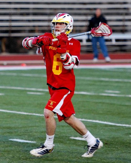 Men’s Lacrosse: Ryan Mickevicious, freshman midfielder, passes the ball during a game against Aquinas on April 14. Photo By: Sam Lehnert | Ad Layout Assistant