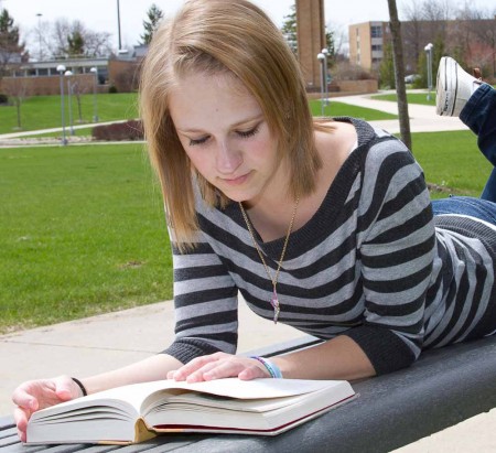 Leisure Reading: Marissa Basty reads Harry Potter during a study break. Students can use the summer to catch up on all their favorite reading. Photo By: Brock Copus | Web Editor