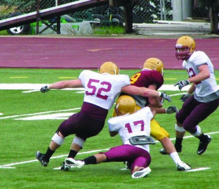 Scrimmage: Ferris football started off the fall season with a scrimmage on Saturday, Aug. 20. Above, Cameron Howard, #52, goes in for a tackle. Photo Courtesy of Barb Howard 