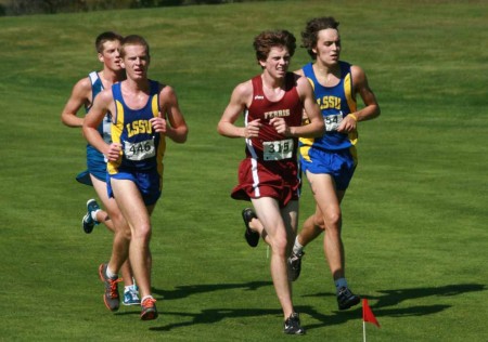 Pushing Forward: Alex Waldvogel, FSU freshman, passes a group of Lake Superior State runners during the Ray Helsing Invitational. Photo By: Kate Dupon | Photo Editor