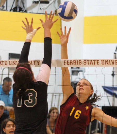 Women’s Volleyball: Mallory Kopa, senior middle hitter, leaps for a ball during a volleyball match. Photo By: Brock Copus | Web Editor