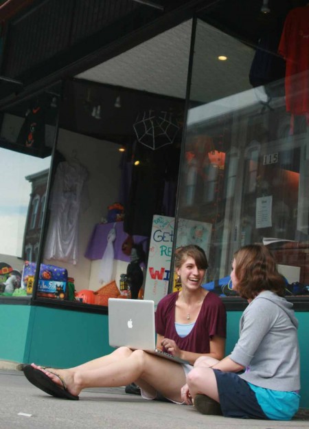 Lending a Hand: Lynn Overmyer and Samantha Martin have been helping to give WISE organization a revamp through new window displays and organizing the contents of the store. Photo By: Kate Dupon | Photo Editor