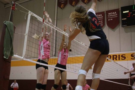 Cleaning House: FSU junior setter Samantha Fordyce and junior middle hitter Anne Sutton leap to block an SVSU hit Oct. 1. The Bulldogs swept the Cardinals just as they have swept twelve of their last fourteen opponents. Photo By: Kate Dupon | Photo Editor