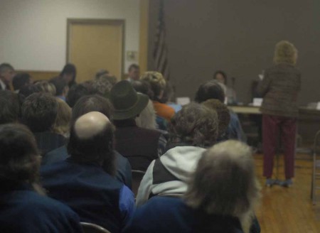 Shirts or Skins?: Community members listen while one woman speaks her opinion about the topless bar that may open near Stanwood. A town meeting was held on Nov. 1 to let community members discuss their opinions. Photo By: Kendall Baumann | Production Assistant