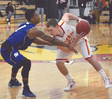 Holding it Back: Ferris State guard Drew Lehman protects the ball from a Grand Valley State defender. The Bulldogs would take a win and a loss on the weekend trip to the Upper Peninsula. Photo By: Eric Trandel | Photographer