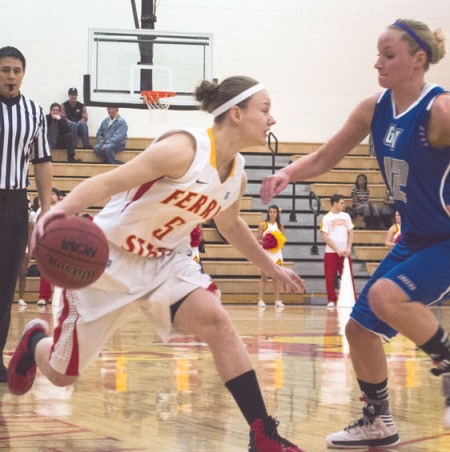 Maintaining Control: Lady Bulldog sophomore guard Morgan Sutton dribbles around a Grand Valley State defender. Ferris State would come out on top over Northern Michigan on the road 73-70. Photo By: Eric Trandel | Photographer