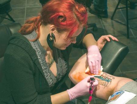 INK’d: Sonya Grenell, Ferris State alumna and tattoo artist, works on a piece at her downtown tattoo studio Lighttouch Tattoo.  Photo By: Eric Trandel | Photographer