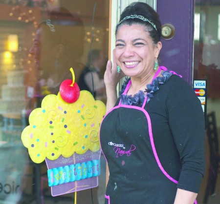 Delicious Treats: Founder Nawal Braden-Swart poses at the storefront of Nawal’s Mediterranean Eatery. The locale offers daily lunch and dinner options as well as cupcakes and other treats. Photo By: Tori Thomas| Photographer