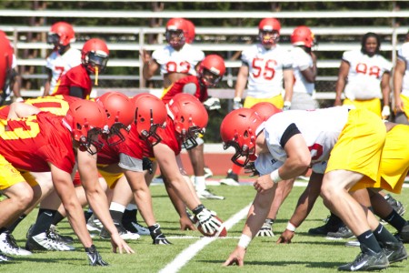 Offense vs. Defense: Members of the offensive and defensive line practice different plays weeks before the start of the season. The Ferris State Bulldogs went 7-4 in last year’s football season. Photo By: Tori Thomas | Photographer