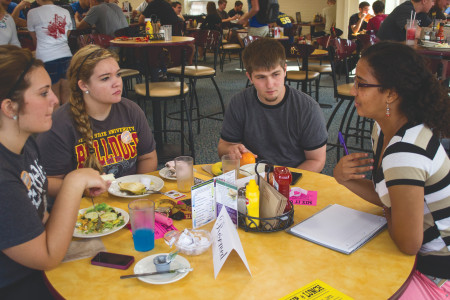 Discussing Diversity: (From left to right) Mabel Acosta, student chair of multicultural exchange, leads a discussion with Caleb Stratton, Sam Goebel and Jessica Heiss about diversity and race at the “Mix it Up” lunch on Sept. 12. 