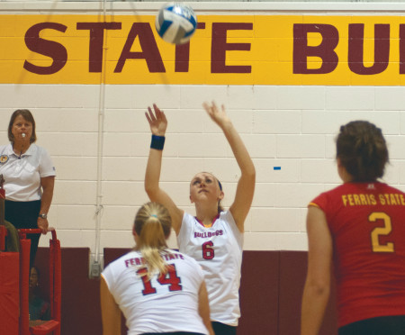 Setting up Victory: Ferris freshman setter Stephanie Sikorski sets up a spike for sophomore outside hitter Caroline Heitzman during the Bulldog Invitational, where they went 3-1 overall. This weekend the women’s volleyball team will take on both Northwood and Hillsdale. Torch File Photo