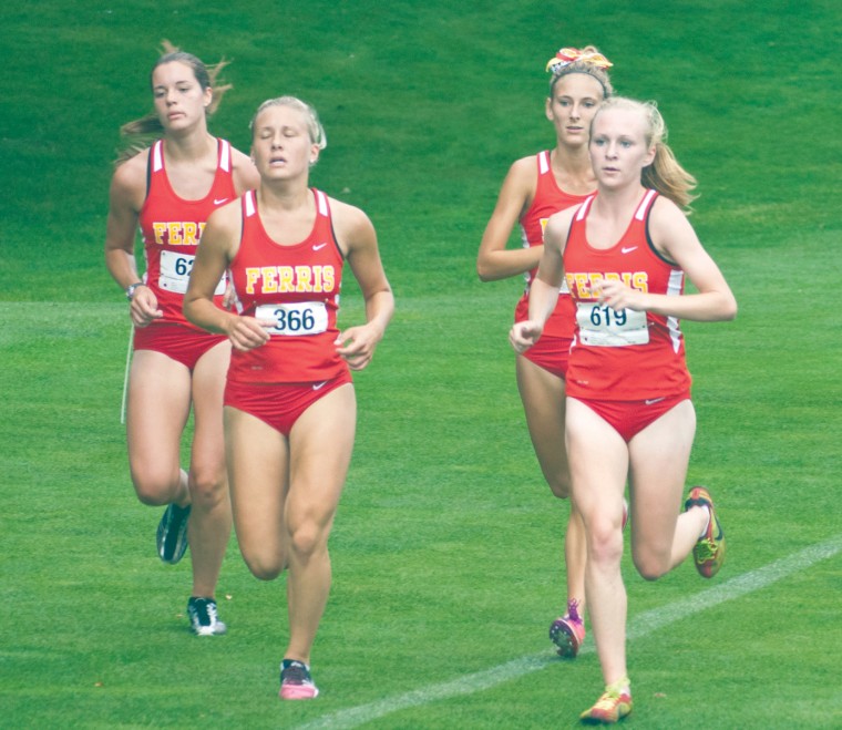 Running with the Pack: Members of the Ferris women’s cross country team race as a pack during the Ray Helsing Bulldog Invitaonal at Katke Golf Course on Saturday. Photo By: Tori Thomas | Photographer