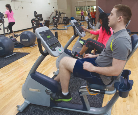 Criminal justice senior Cody Riley works out on one of the Rec Center’s many bicycle machines before doing some strength training. The Rec Center also offers workout classes called CrossFit for those looking to get more out of their workout. Photo By: Melanie Ronquillo | Photographer