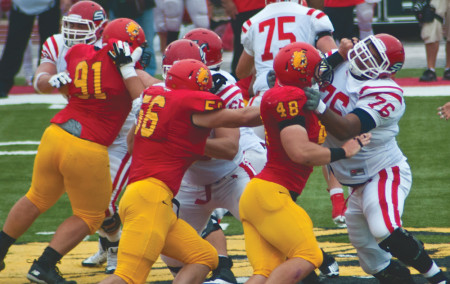 Quaterback Jason Vander Laan runs the ball past Saginaw Valley’s defense during the 2013 homecoming game this past fall. Vander Laan and the Bulldogs went 8-3 overall this season and begin training for the next season this spring. Torch File Photo