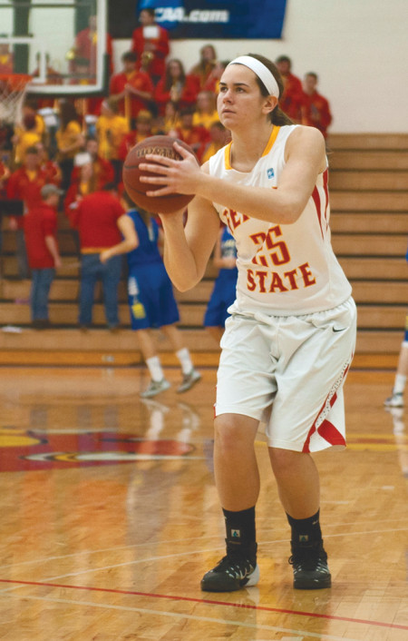 Freshman Kendra Enszer warms up before the 2nd half of the game against Lake Superior State, which Ferris won 74-71. Enszer is a Big Rapids native and has had her eyes set on playing basketball for Ferris for years. Photo By: Tori Thomas | Photographer