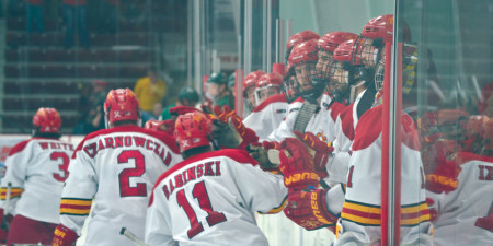 The Ferris State hockey team mobs senior captain and defensman Scott Czarnowczan following his shorthanded game-winning goal in the second overtime in his last home game against the Bemidji State Beavers on March 15. Photo By: Tori Thomas | Photographer 