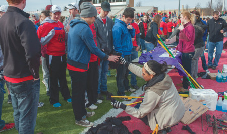 Volunteers collect the materials they will use to clean up the town for the Big Event. The Big Event is an annual tradition uniting campus and community as students clean up yards throughout Big Rapids.