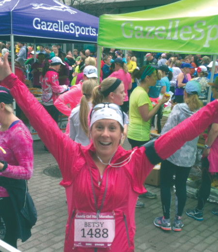 Professor Betsy Verwys celebrates after completing the Gazelle Girl Marathon in Grand Rapids, raising money for SowHope with every mile she ran.  Photo Provided By: Betsy Verwys 