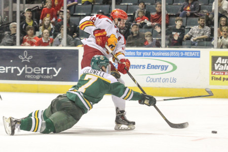 Garrett Thompson sneaks by an Alaska-Anchorage defender during the WCHA Semi-Final game in Van Andel Arena in Grand Rapids. (Photo by Brock Copus, Multimedia Editor)