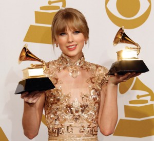 Taylor Swift with her awards at the 54th Annual Grammy Awards at the Staples Center in Los Angeles, California, on Sunday, February 12, 2012.