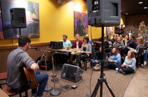 The crowd at Biggby enjoys Jordan McNaughton, a sophomore in Music Industry Management, play his guitar to some well known songs and some original works.