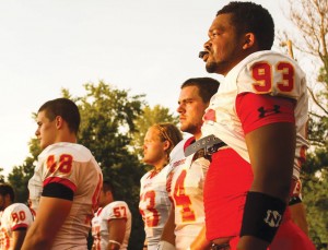 Ferris State football’s defense stands together on the sideline prior to facing off against the McKendree University Bearcats.