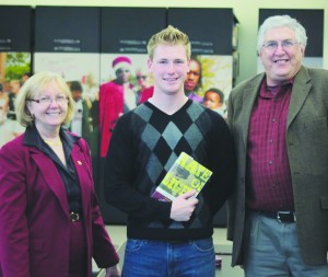 Tom Shanahan, right, is a Big Rapids native and promoted his new book “Raye of Light.” Its an interesting read for football fans, history buffs and those concerned with social justice and civil rights. Shanahan is with Ferris student and sports management major Nathan Wells, center, and communications professor Dr. Sandra Alspach, left.