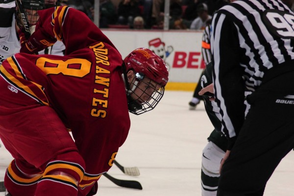 Freshman forward Drew Dorantes leans in for a face-off against Michigan State.