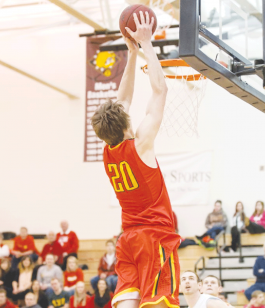 Stolicker using his 6 foot 10 frame to dunk during a home game last season. Stolicker is the team’s top rebounder and has excelled in blocking shots with his rangy wingspan.