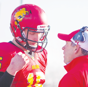 Head coach Tony Annese and junior quarterback Jason Vander Laan share a moment towards the end of the 46-33 loss to Ohio Dominican.