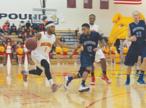 Junior point guard Dietrich Lever leads the men’s basketball team up the court. Lever and the Dawgs won and lost a contest during their two game weekend set.