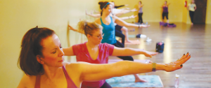 A group of women practice yoga at the Yoga Shelter in West Bloomfield, Michigan on Wednesday, December 31, 2014. 