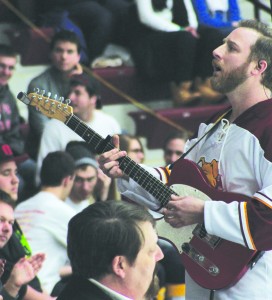 Bulldog fans share a musical moment with a special guest during a media timeout.