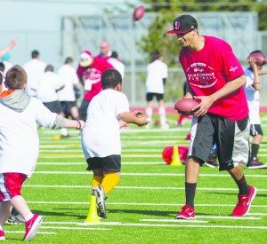 Kids participate in a group camp with the San Francisco 49er’s, quarterback Colin Kaepernick, in Pacifica, California.