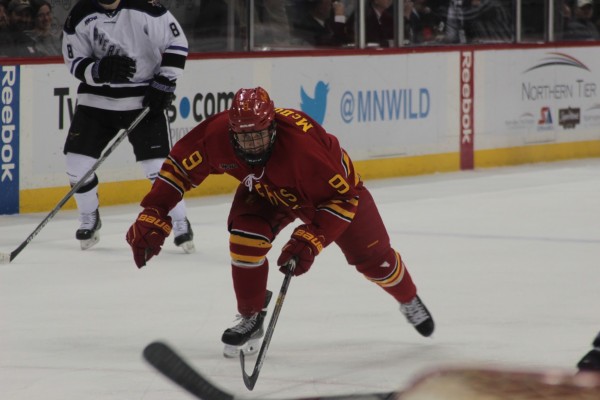 Sophomore forward Chad McDonald lunges for a puck in the offensive zone against Minnesota State.