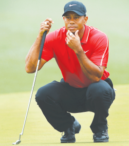 Tiger Woods looks over the second green prior to putting during the final round of the Masters on Sunday, April 12, 2015, at Augusta National Golf Club in Augusta, Ga.