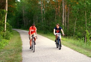 Xavier Locke and Austin Benzing ride the White Pine Trail north of Big Rapids.
