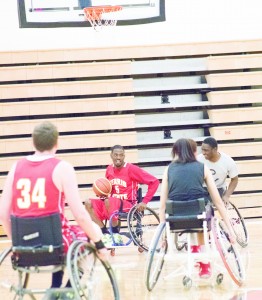 Ferris State basketball’s James Chappell looks for an open lane at last week’s wheelchair basketball event.