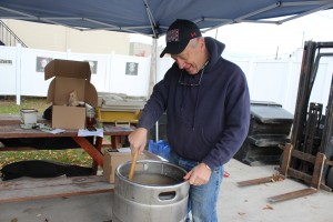 Rick Marek, of the Big Rapids Area Master Mashers, stirs a a batch of home-brewed rye pale ale last weekend at BAMM’s “Learn How to Brew” event at Cranker’s Brewery.